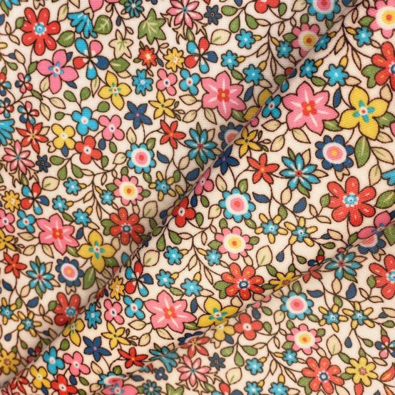 Tissu enduit  au mètre mille et une fleurs