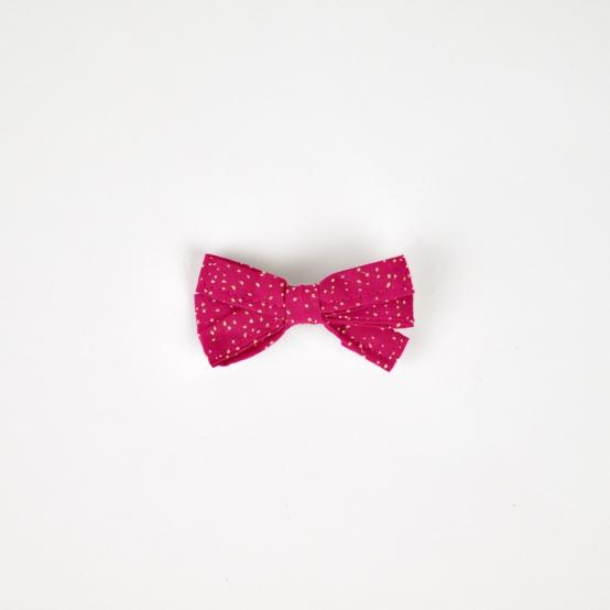 Barrette noeud ruban fuchsia pailleté