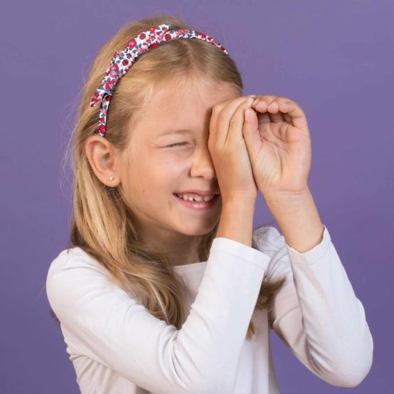 Serre-tête noeud rouge corolle