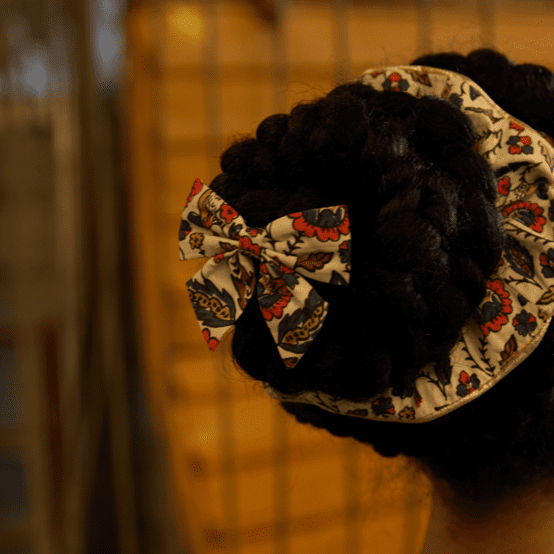 Barrette noeud papillon plumes d'été