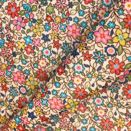 Tissu enduit  au mètre mille et une fleurs