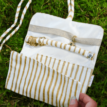 Pochette à bijoux rayé or blanc