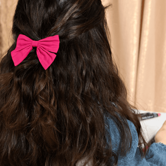 Barrette noeud papillon fuchsia