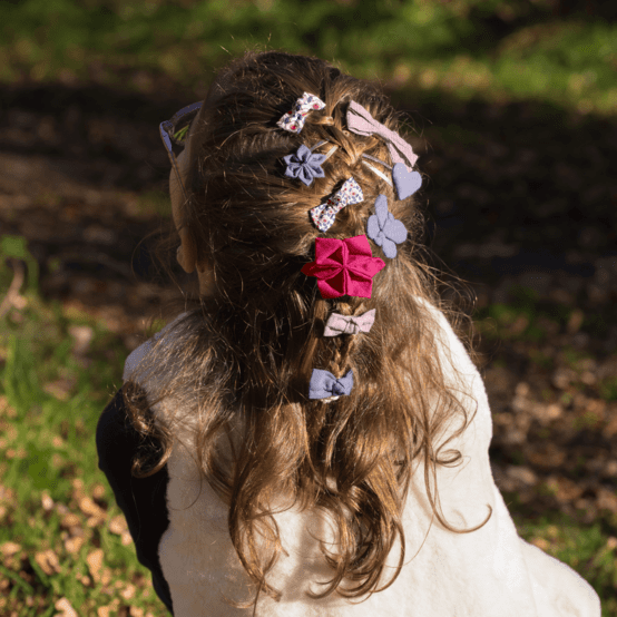 Barrette fleur étoile fuchsia pailleté