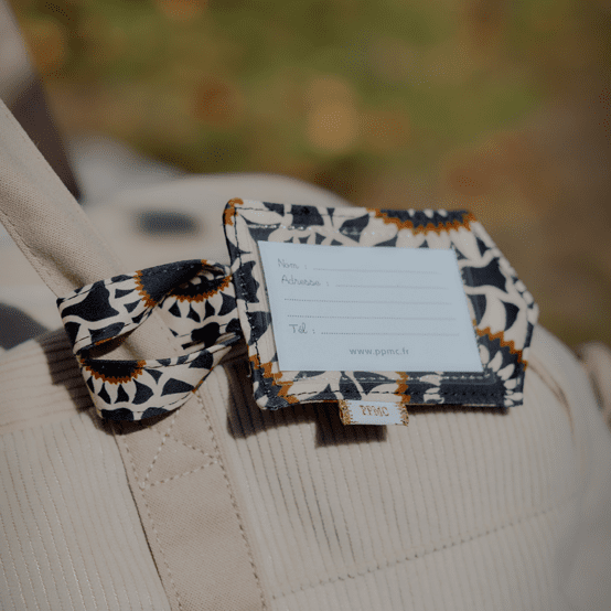 Etiquette bagage attrape soleil