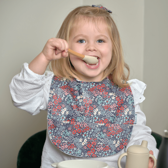 Bavoir tissu plastifié jardin d'aurore