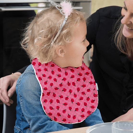 Bavoir tissu plastifié vichy coccinelle