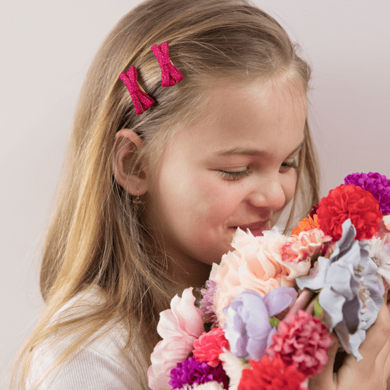 Barrette noeud ruban fuchsia pailleté