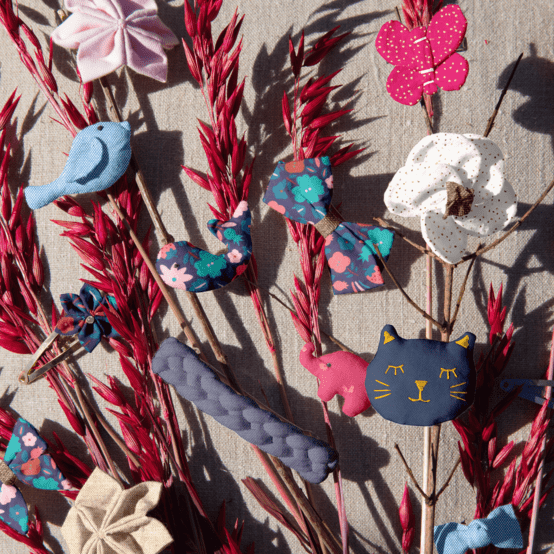 Barrette petit papillon fuchsia pailleté