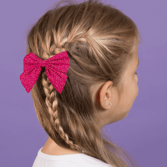 Barrette noeud papillon fuchsia pailleté