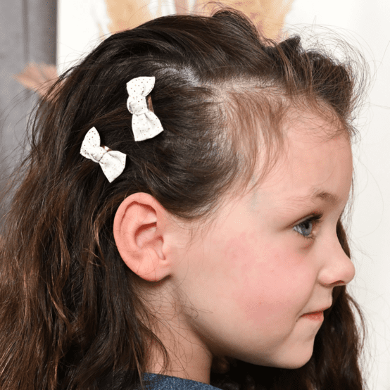 Barrettes clic-clac petits noeuds  blanc pailleté