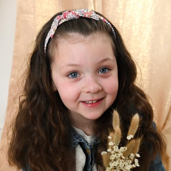 Serre-tête noeud porcelaine rosée