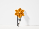 Barrette clic-clac fleur étoile ochre