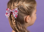 Barrette noeud papillon rouge corolle