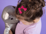 Barrettes clic-clac petits noeuds fuchsia pailleté