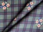 Tissu enduit au mètre tartan fleuri