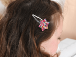 Barrette clic-clac fleur étoile cocktail de fleurs