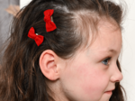 Barrettes clic-clac petits noeuds rouge