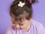 Barrette petit papillon rayé or blanc