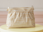 Pochette plissée rayé or blanc