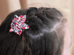 Barrette fleur étoile rouge corolle